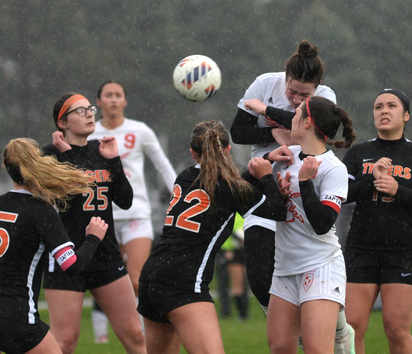 Oregon's Teagan Champley heads the ball on a corner kick against Byron on Thursday, April 18, 2024 at Byron High School. The Tigers won the game 2-1.