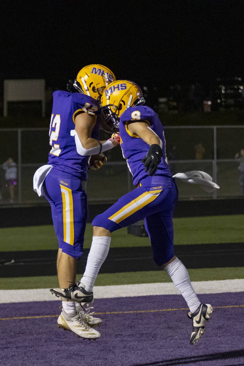 Mendota's William Musanovic celebrates with Braiden Freeman after Freeman's touchdown against Sherrard High School at Mendota High School on September 27, 2024.