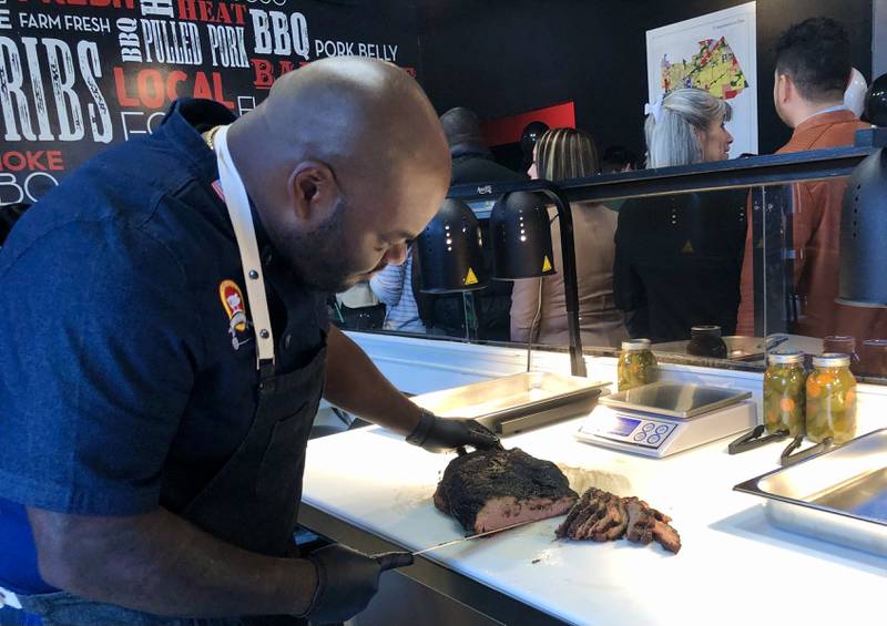 Owner of Hell's BBQ Keith Richards examining the smoke rings as he slices his brisket at a friends and family event Oct. 30 2022.