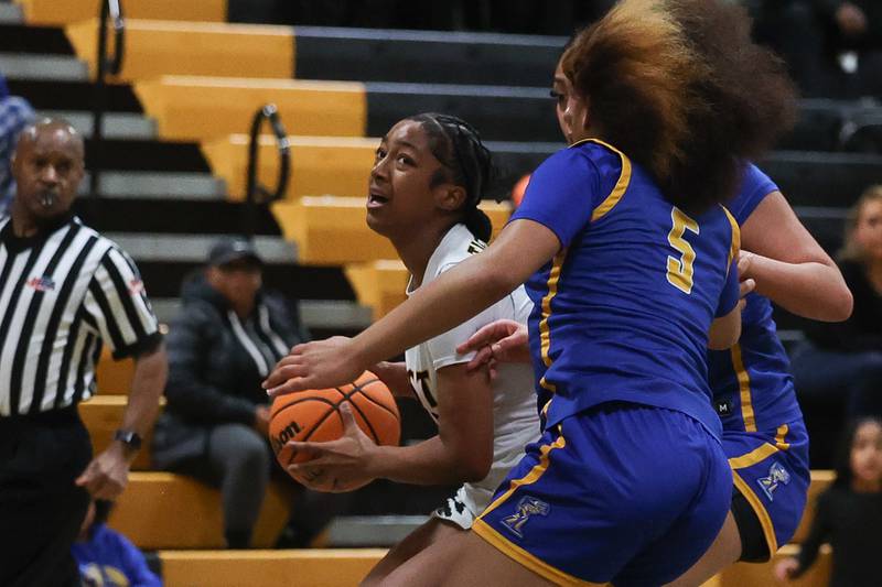Joliet West’s Gabrielle Gavin battle to the basket against Joliet Central on Thursday, Jan 30, 2025 in Joliet.
