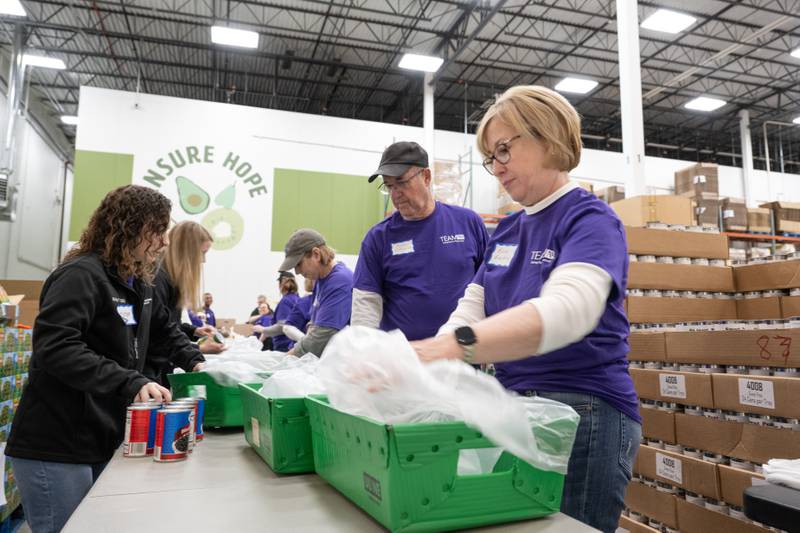 More than 100 volunteers from Northwestern Medicine came out to the Northern Illinois Food Bank's Geneva location to pack up donations on Saturday, Feb. 24, 2024. Northwestern Medicine donated $200,000 across area food banks including three NIL food bank locations — Geneva, Joliet and Lake Forest — and the Greater Chicago Food Depository.