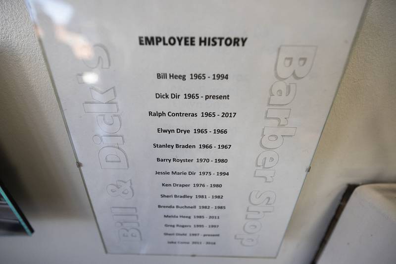 An employee list is posted on the wall of the barbershop Monday, March 30, 2026.