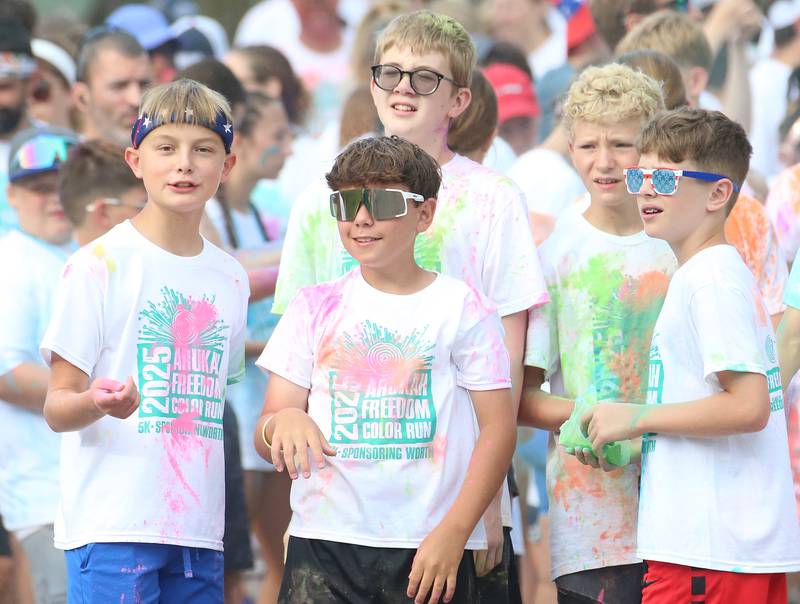 (From left) Brecken Waca, AJ Anderson, Liam Johnson, Grant Zimmerman and Eli Cochern gather at the starting line during the Arukah Institute of Healing Freedom Color Run on Friday, July 4, 2025 at Soldiers and Sailors Park in Princeton.