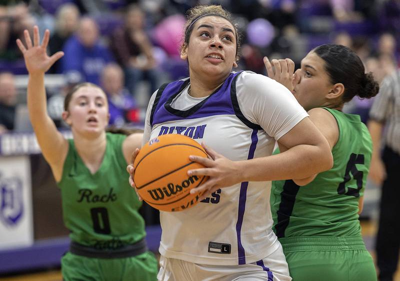 Dixon's Hallie Williamson turns towards the hoop against Rock Falls’ Autumn Weatherby  Friday, Jan. 31, 2025, at Dixon High School.