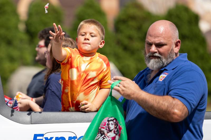 Charles Badger throws candy from truck on Sunday, Aug 31, 2025 at the Labor Day parade on Main Street in Streator.