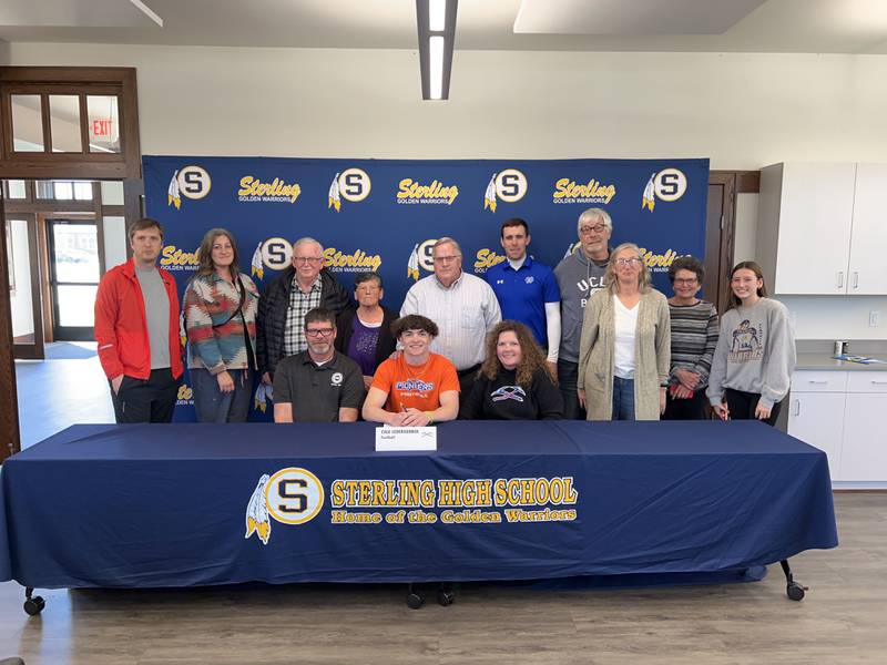 Sterling's Cale Ledergerber poses for a picture after signing to football at the University of Wisconsin-Platteville April 24 at the Sterling Schools Foundation building in Sterling.