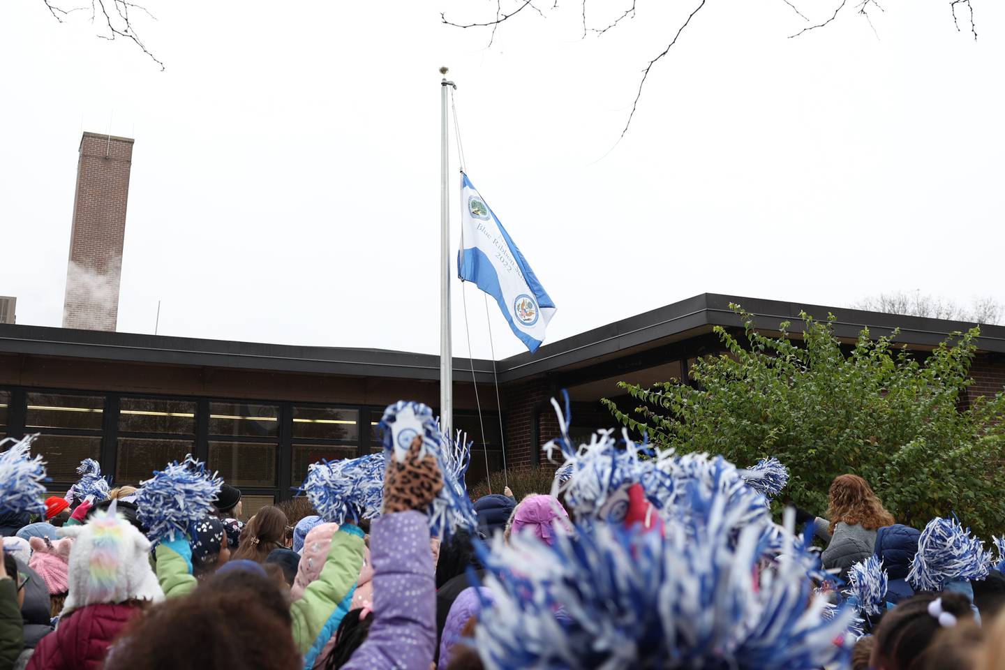 Eisenhower Academy students cheer as the 2022 National Blue Ribbon flag is raised outside the school on Tuesday. Eisenhower Academy was named a 2022 National Blue Ribbon School, the nation’s highest education award. The Joliet Public School District 86 Magnet School was also awarded the honor of being named a National Blue Ribbon School in 2016.