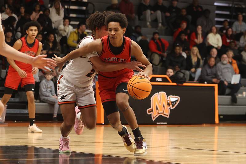 Bolingbrook’s Davion Thompson makes a move against Minooka on Tuesday, Dec. 17, 2024 in Minooka.
