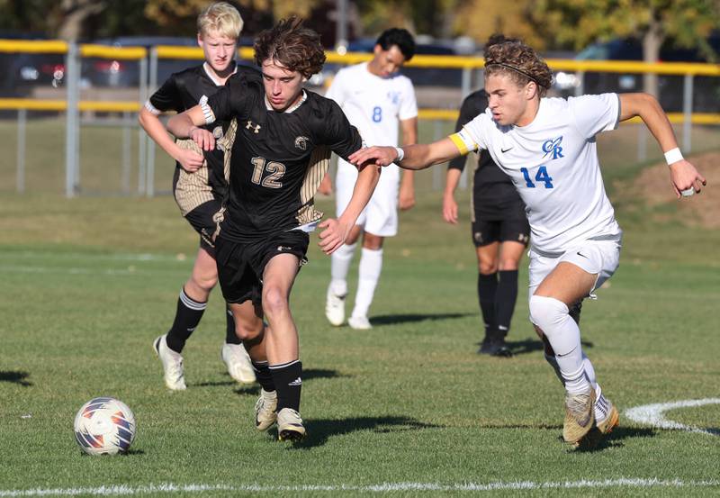 Sycamore's Maddux McLaughlin (left) and Burlington Central's Noah Rosborough race for the ball Wednesday, Oct. 23, 2024, during their Class 2A Sycamore Regional semifinal.