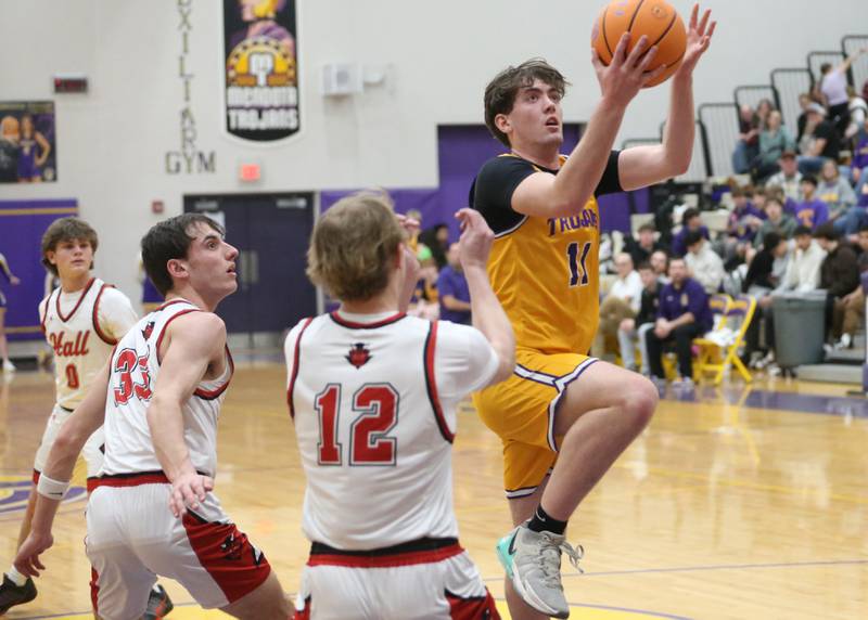 Mendota's Aden Tillman runs in the lane to score over Hall's Hunter Edgcomb on Tuesday, Feb. 3, 2026 at Mendota High School.