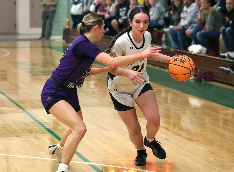 Kaneland's Kyra Lilly tries to drive by Dixon’s Morgan Hargrave during their Class 3A sectional semifinal game Tuesday, Feb. 25, 2025, at Boylan Catholic High School in Rockford.