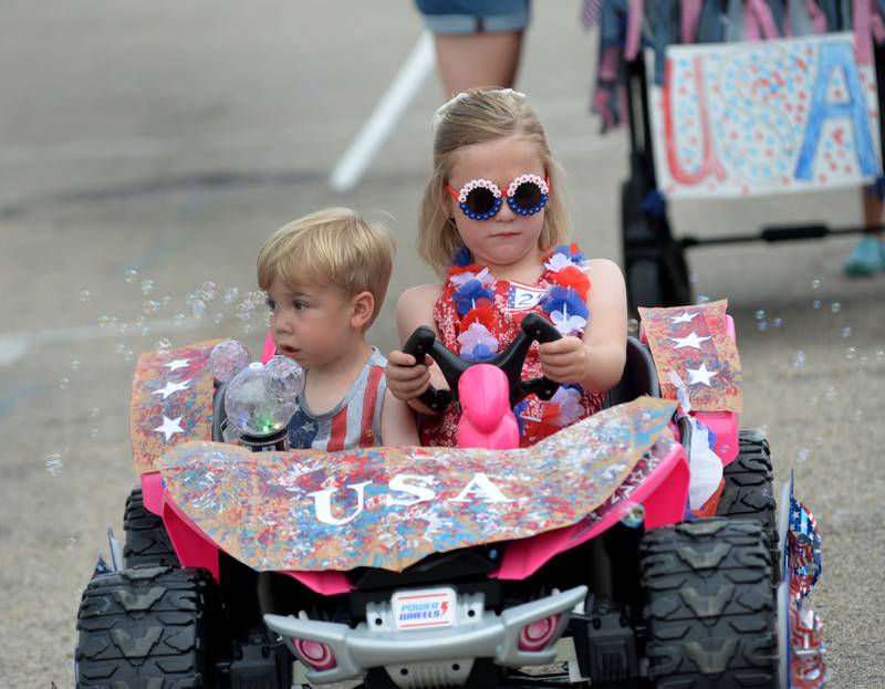 Natalie and Grffin Schmidt wait to start the Let Freedom Ring Kiddie Parade on Saturday, July 5, 2025.