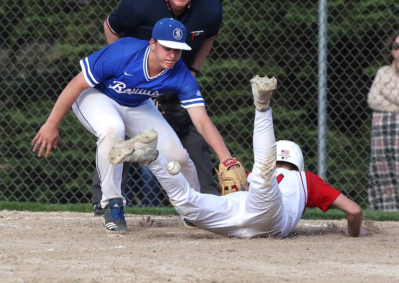 Indian Creek's Jacob Coulter scores from third on a wild pitch as Hinckley-Big Rock's Luke Badal can’t corral the throw during their game Monday, April 29, 2024, at Indian Creek High School.