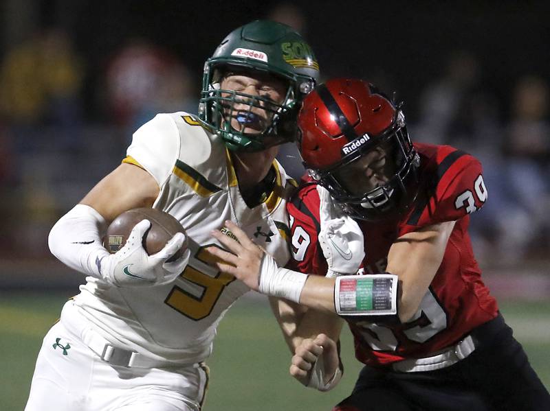 Huntley's Benjamin Wean knocks Crystal Lake South's Colton Hess out of bounds during a Fox Valley Conference football game on Friday, Sept. 29, 2023, at Huntley High School.