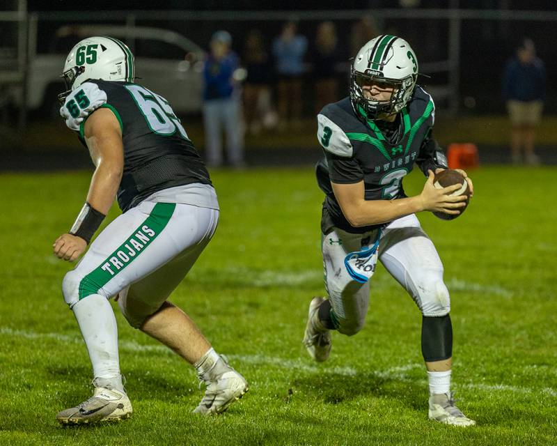 Jake Wilkey (65) of Dwight stands guard as teammate Collin Bachand (3) runs ball on Friday, Sept. 19, 2025 at Dwight High School in Dwight.