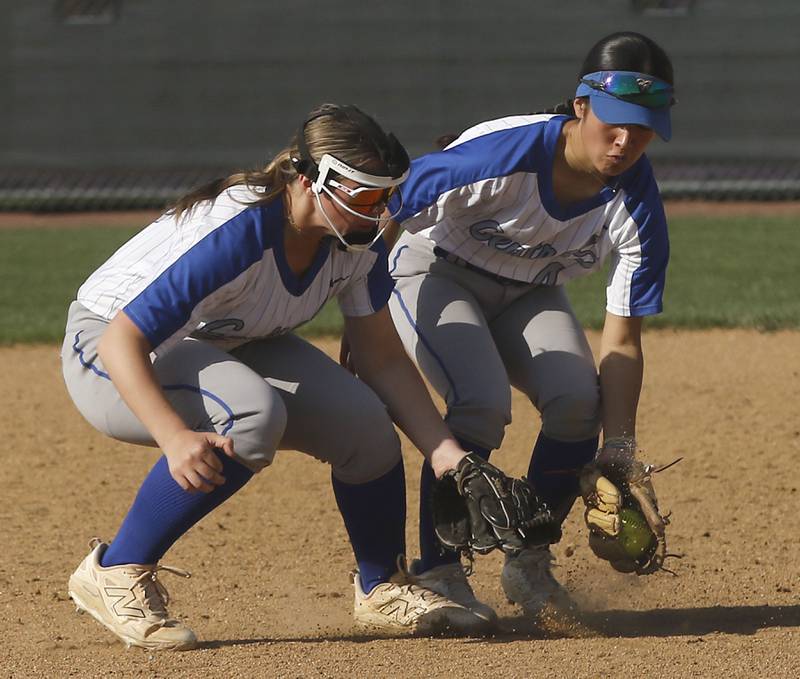 Burlington Central's Alexis Skarda and Mei Shirokawa almost collide as the go for a ground ball during a Fox Valley Conference softball game against Hampshire on Tuesday, April 21, 2026, at Hampshire High School.