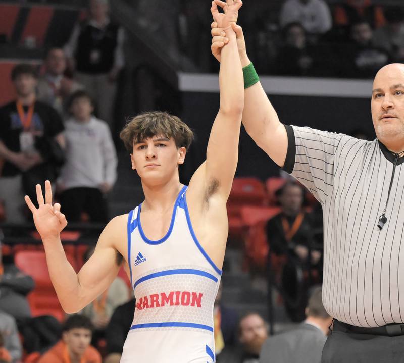 Marmion Academy’s Nicholas Garcia celebrates his third championship at the boys IHSA wrestling finals at State Farm Center in Champaign on Saturday, Feb. 21, 2026.