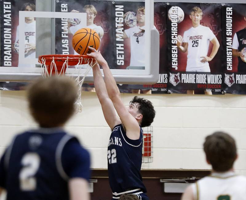 Cary-Grove's Adam Bauer tries to dunk the basketball during the IHSA Class 3A Prairie Ridge Regional championship basketball game against Crystal Lake South on Friday, Feb. 28, 2025, at Prairie Ridge High School in Crystal Lake.
