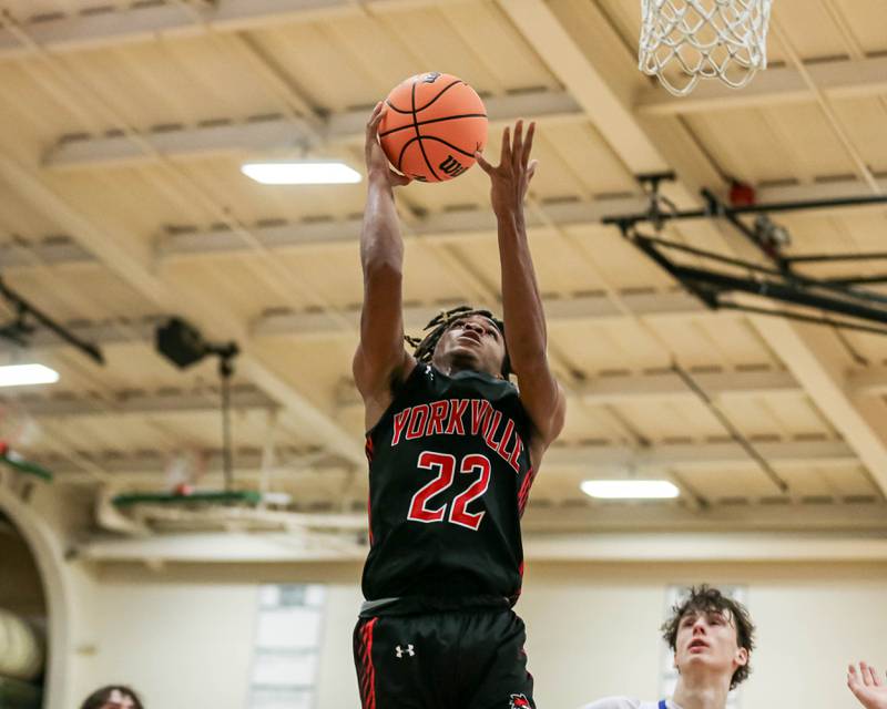 Yorkville's Braydon Porter (22) puts in a lay up during their Jack Tosh Holiday Classic basketball tournament game between St Francis at Yorkville Thursday Dec 26, 2024 in Elmhurst.