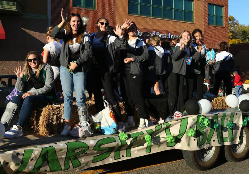 St. Bede volleyball players ride in the Homecoming parade on Friday, Sept. 30, 2022 downtown Peru.