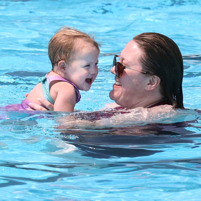 Beverly Gardner and her daughter Daphne, 2, from DeKalb, beat the heat with a swim Tuesday, July 25, 2023, at Hopkins Pool in DeKalb.