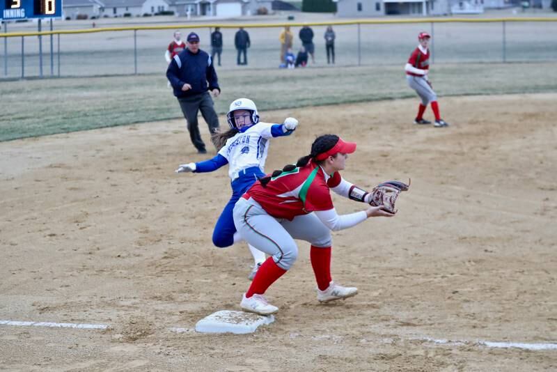 L-P's Maddie Pangrcic takes the throw as Princeton's Mckenzie Hecht slides into third base Tuesday at Little Siberia Field in Princeton. The Cavs won 15-8.