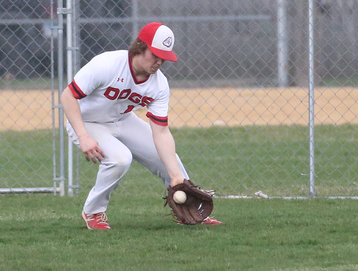 Streator's Cole Martin fields a ground ball in center field against Peotone on Tuesday, April 4, 2023 in Streator.