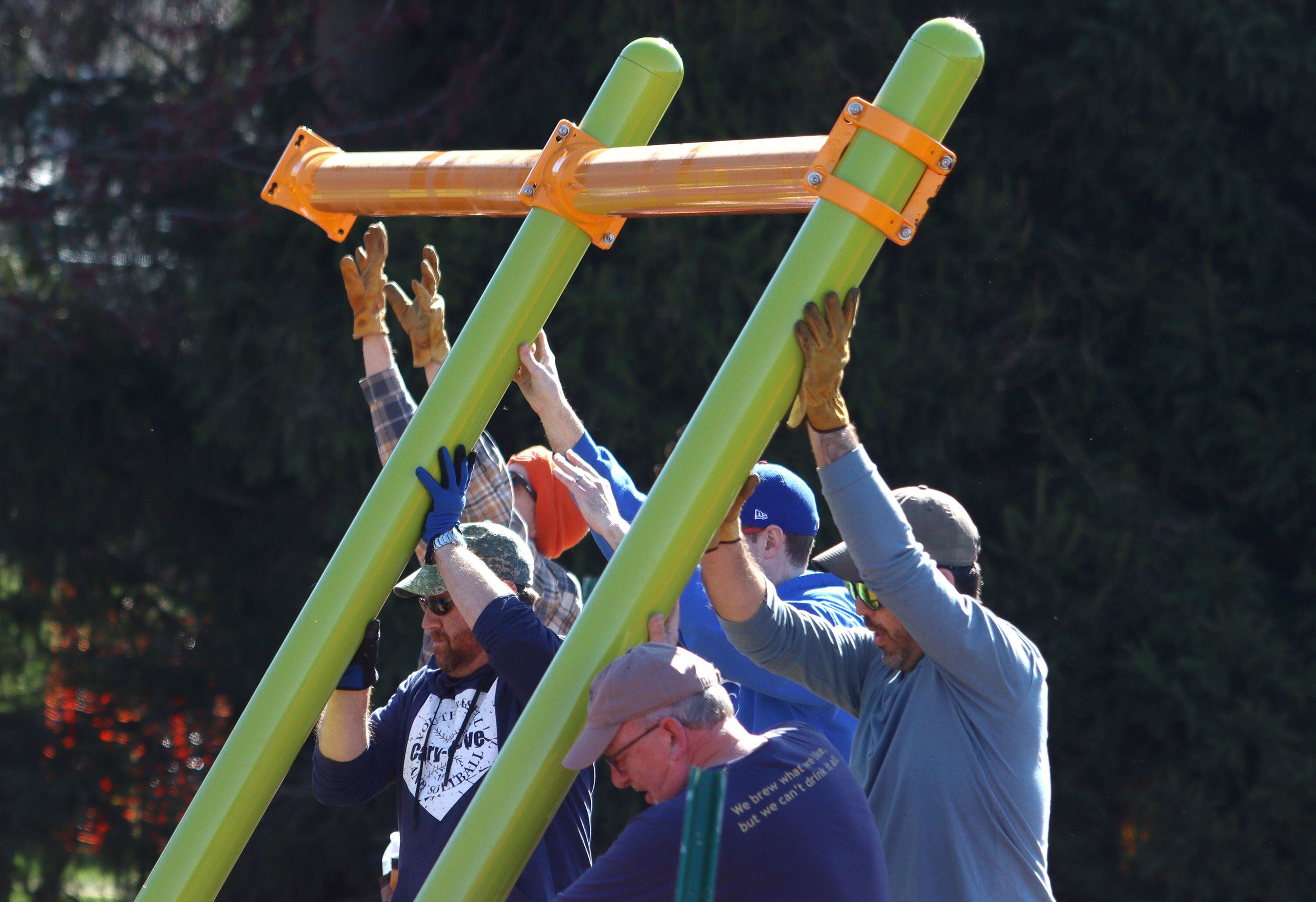 Volunteers and friends of Three Oaks Elementary School constructed a new playground at the Cary school on Saturday.