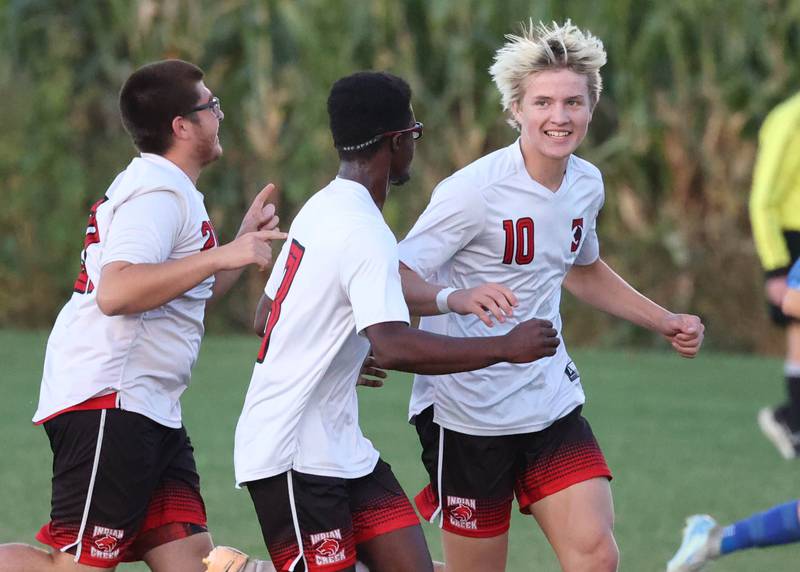 Indian Creek's Parker Murry (right) celebrates his goal with his teammates during their game Wednesday, Oct. 2, 2024, at Hinckley-Big Rock High School.