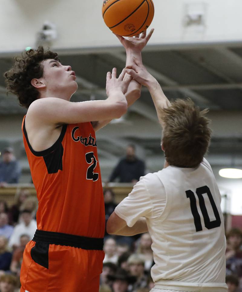 Crystal Lake Central's Danny Spychala is fouled by Prairie Ridge's Luke Muse as during an IHSA Class 3A Prairie Ridge Regional basketball game on Monday, Feb. 24, 2025, at Prairie Ridge High School.