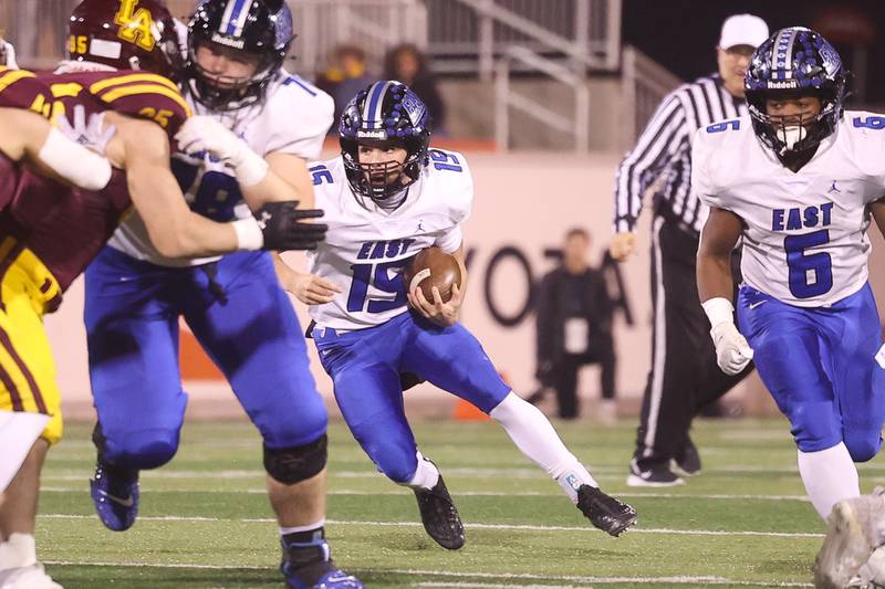 Lincoln-Way East’s Braden Tischer runs the ball up the middle against Loyola in the Class 8A championship on Saturday, Nov. 25, 2023 at Hancock Stadium in Normal.