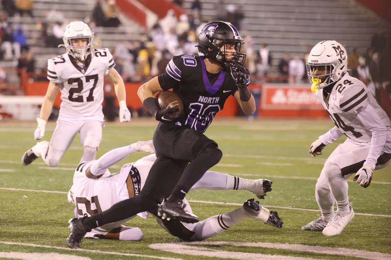 Downers Grove North’s Oliver Thulin snips out of a tackle after a catch against Mt. Carmel in the Class 7A championship on Saturday, Nov. 25, 2023 at Hancock Stadium in Normal.