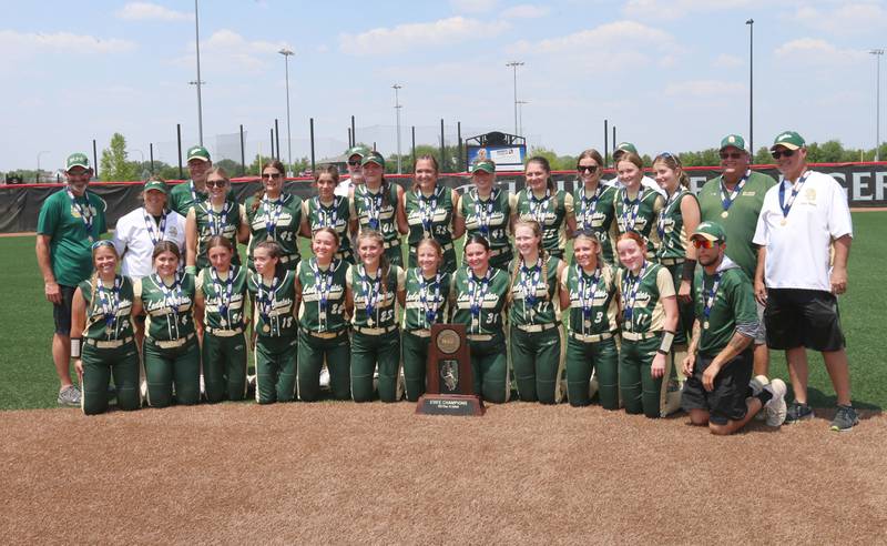 Members of the St. Bede Lady Bruins softball team pose with the Class 1A championship trophy after defeating Illini Bluffs on Saturday, June 3, 2023 at the Louisville Slugger Sports Complex in Peoria.