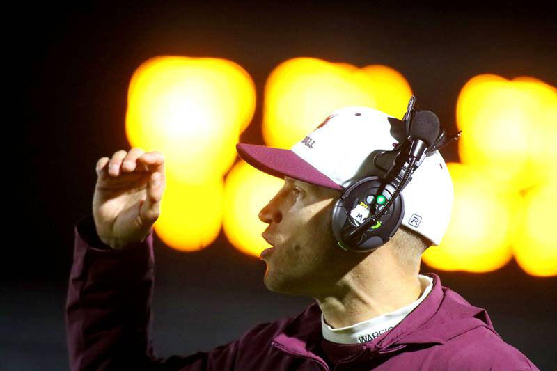 Prairie Ridge’s Head Coach Mike Frericks guides the Wolves against Vernon Hills in IHSA football Class 5A first-round playoff action at Prairie Ridge High School in Crystal Lake on Friday, October 31, 2025.