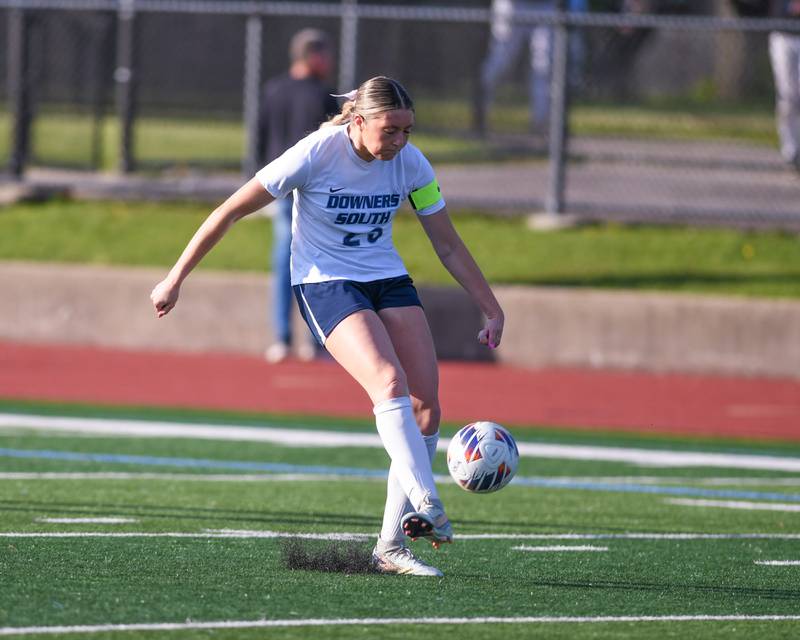 Downers Grove South's Ashley Molinari (23) kicks the ball away to a teammate during the regional title game on Friday May 23, 2025, while taking on York at York High School.