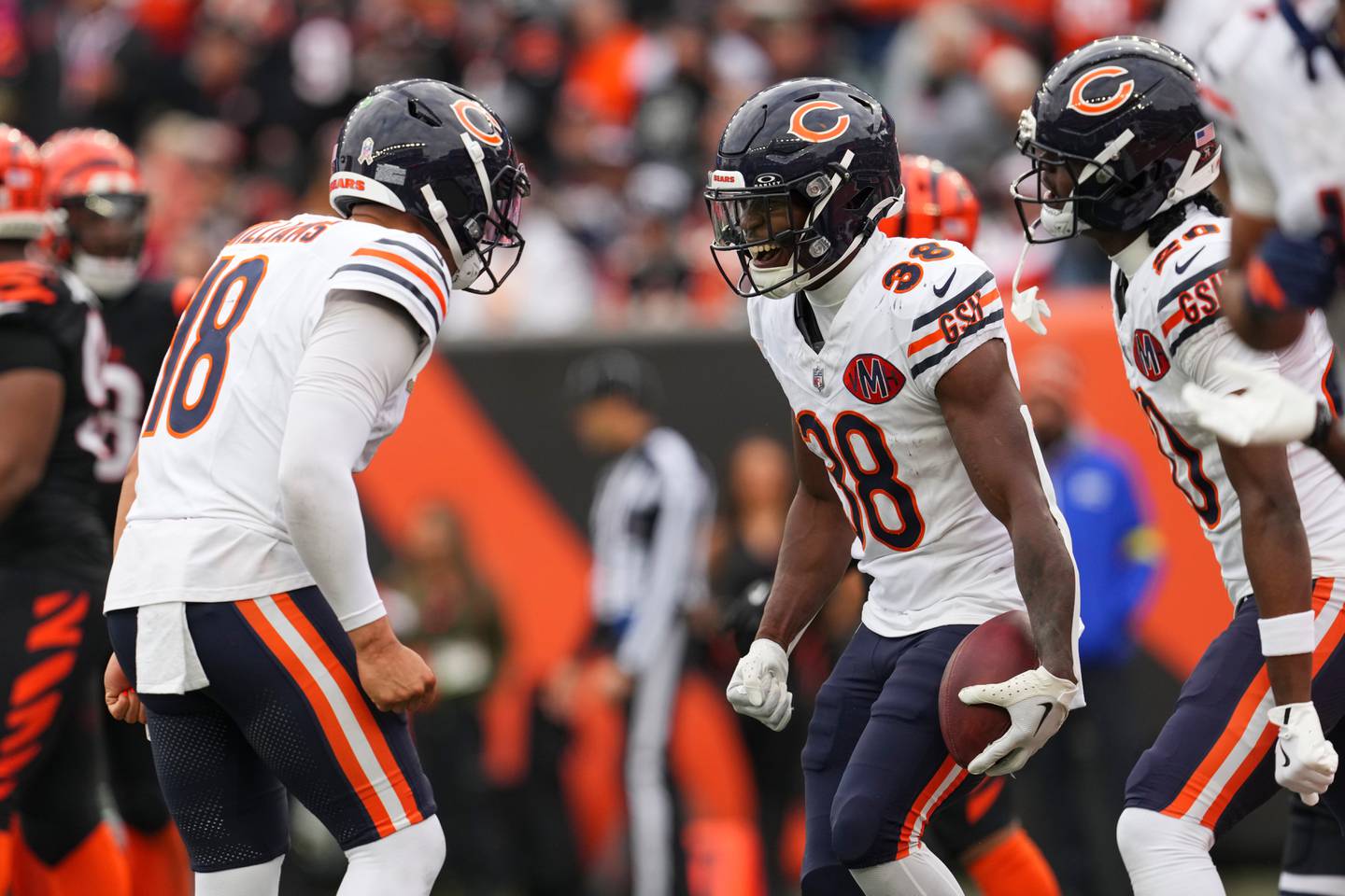Chicago Bears running back Brittain Brown (38), right, celebrates his touchdown with quarterback Caleb Williams (18) during the second half of an NFL football game against the Cincinnati Bengals, Sunday, Nov. 2, 2025, in Cincinnati. (AP Photo/Jeff Dean)