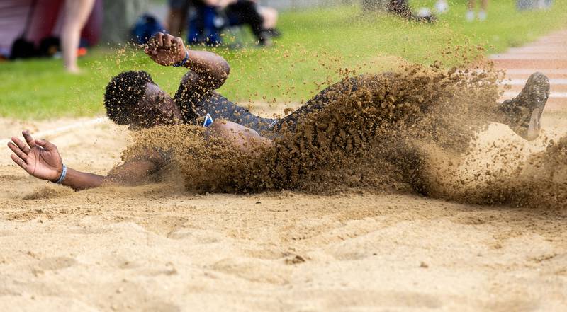 St. Charles North’s Andre Smith participates in the long jump during the Dukane Conference Boys Track and Field Meet hosted by Lake Park High School in Roselle on Friday, May 16, 2025.