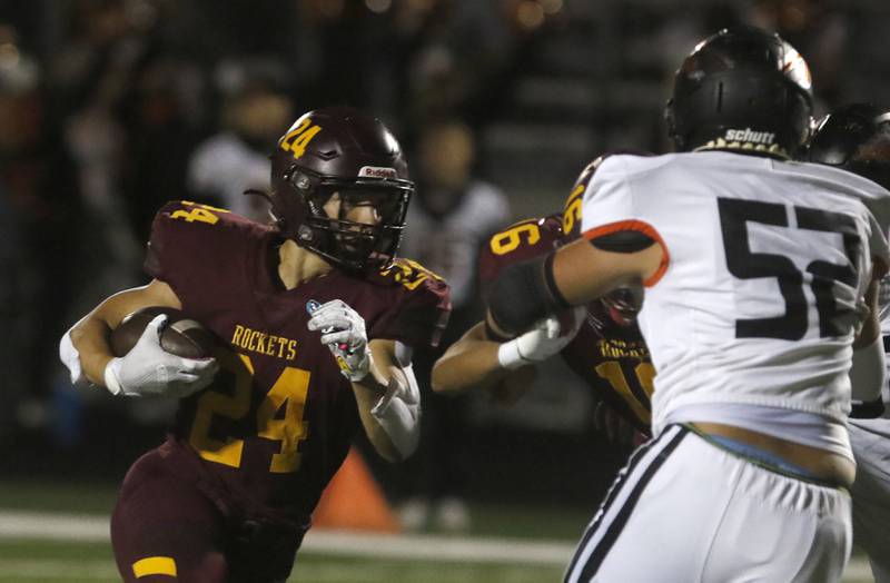 Richmond-Burton's Hunter Carley runs behind the block of Ryan Wisniewski on Sandwich's Devon Blanchard during a Kishwaukee River Conference football game on Friday, Oct. 4, 2024, at Richmond-Burton High School.
