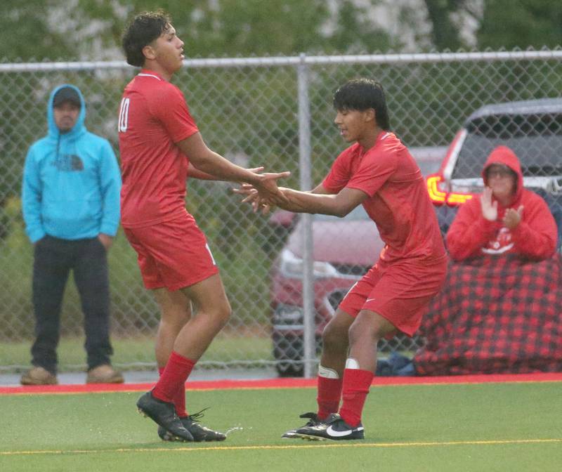 L-P's Giovanni Garcia hi-fives teammate Emir Moarales after scoring a goal against Ottawa on Monday, Sept. 11, 2023 at the L-P Athletic Complex in La Salle.