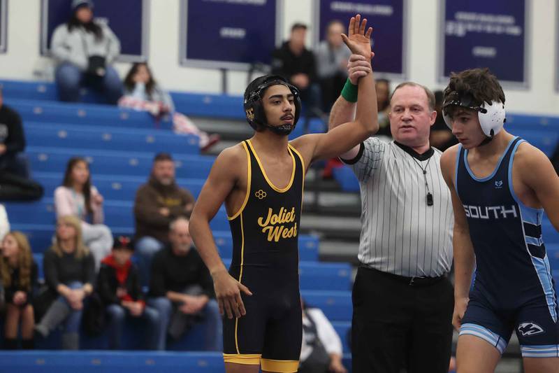 Joliet West’s Adrian Hernandez gets the first round fall over Plainfield South’s Jimmy Medina in the 138-pound match on Wednesday, Dec. 11, 2024 in Plainfield.