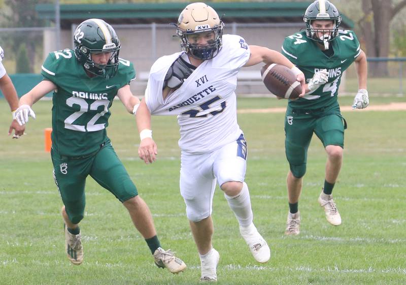 Marquette's Jaxsen Higgins sprints down the field as St. Bede defenders Ryan Nawa and Phillip Gray chase after him during the Homecoming game on Saturday, Sept. 28, 2024 at St. Bede Academy.