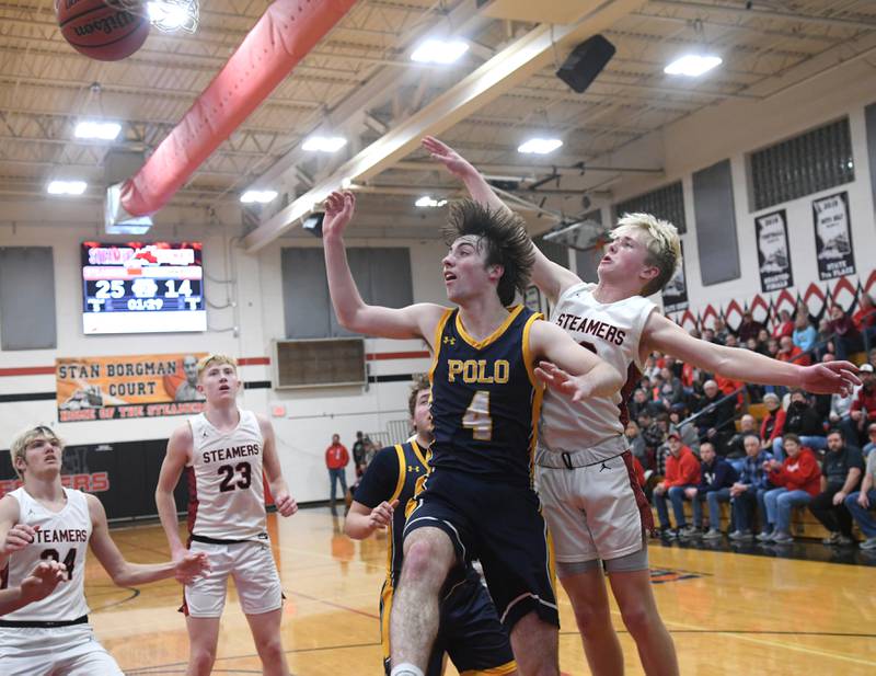 Polo's Brock Soltow (4) and Fulton's Trevor Tiesman (10) reach for a rebound during a  Jan. 13 game in Fulton.