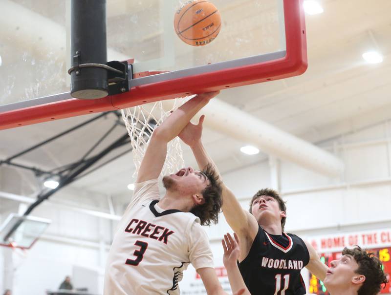 Indian Creek's Logan Schrader scores on a layup against Woodland's Nate Berry during the Class 1A Sectional Semifinal game on Wednesday, March 4, 2026 at Amboy High School.