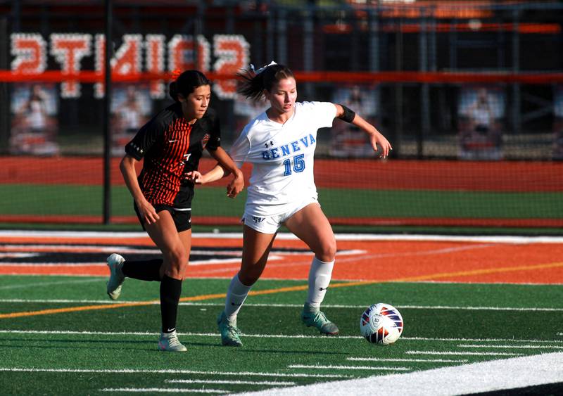 St. Charles East's Mya Leon and Geneva's Lila Homewood go after the ball during the Class 3A St. Charles East Regional final on Friday, May 23, 2025 in St. Charles.
