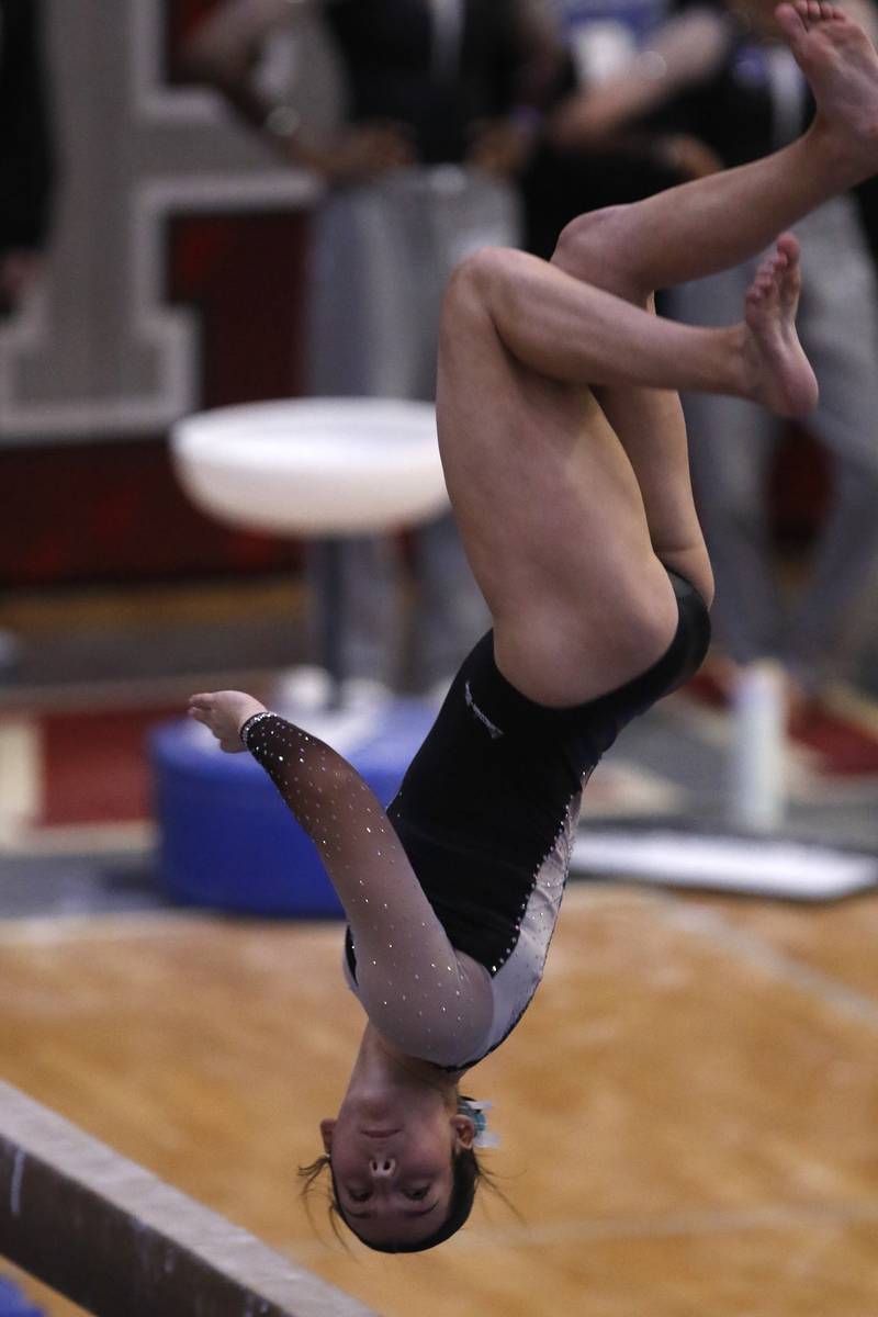 Lincolnway East's Alaina Leskki competes in the preliminary round of the balance beam on Friday, Feb. 21, 2025, during the IHSA Girls State Final Gymnastics Meet at Palatine High School.