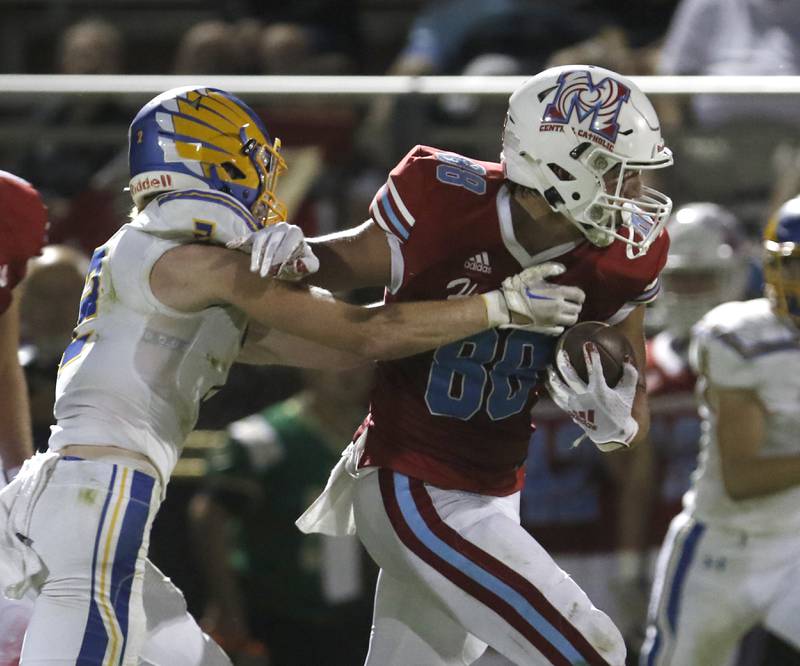 Johnsburg's Ian Boal tries to tackle Marian Central's Christian Bentancur during a non-conference football game Friday, Sept. 2, 2022, between Marian Central and Johnsburg at Marian Central High School.