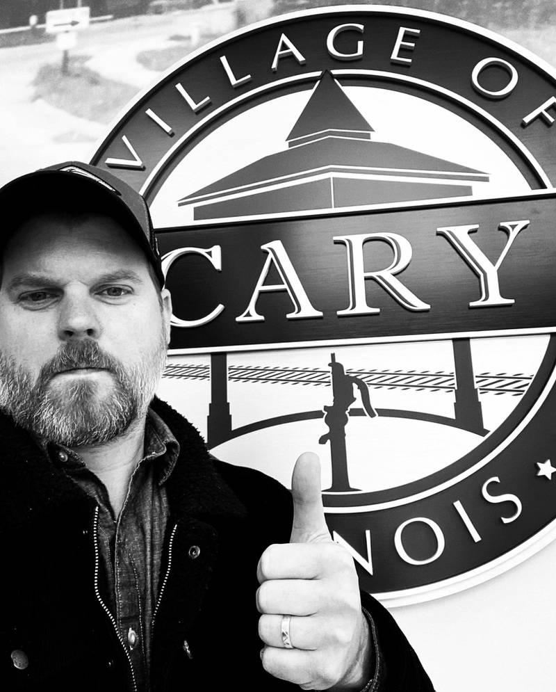 Cary native David Prusina, a drummer for "The Allstars", is one of two newcomers running for a seat on the Cary Village Board of Trustees in the upcoming election on April 4, 2023.