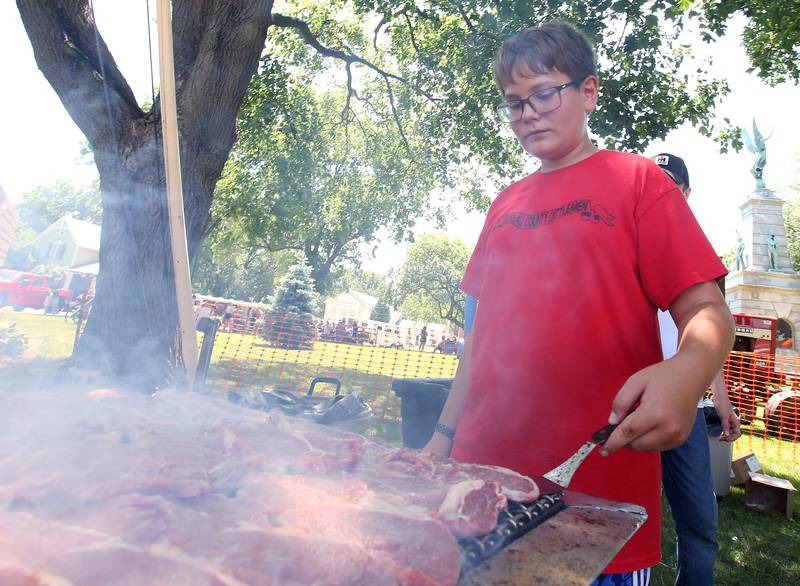 Lance Monier, flips ribeyes during the 46th annual Beef and Ag Festival on Saturday, June 21, 2025 at Soldiers and Sailors Park in Princeton. Monier is a third-generation Bureau County Cattleman.