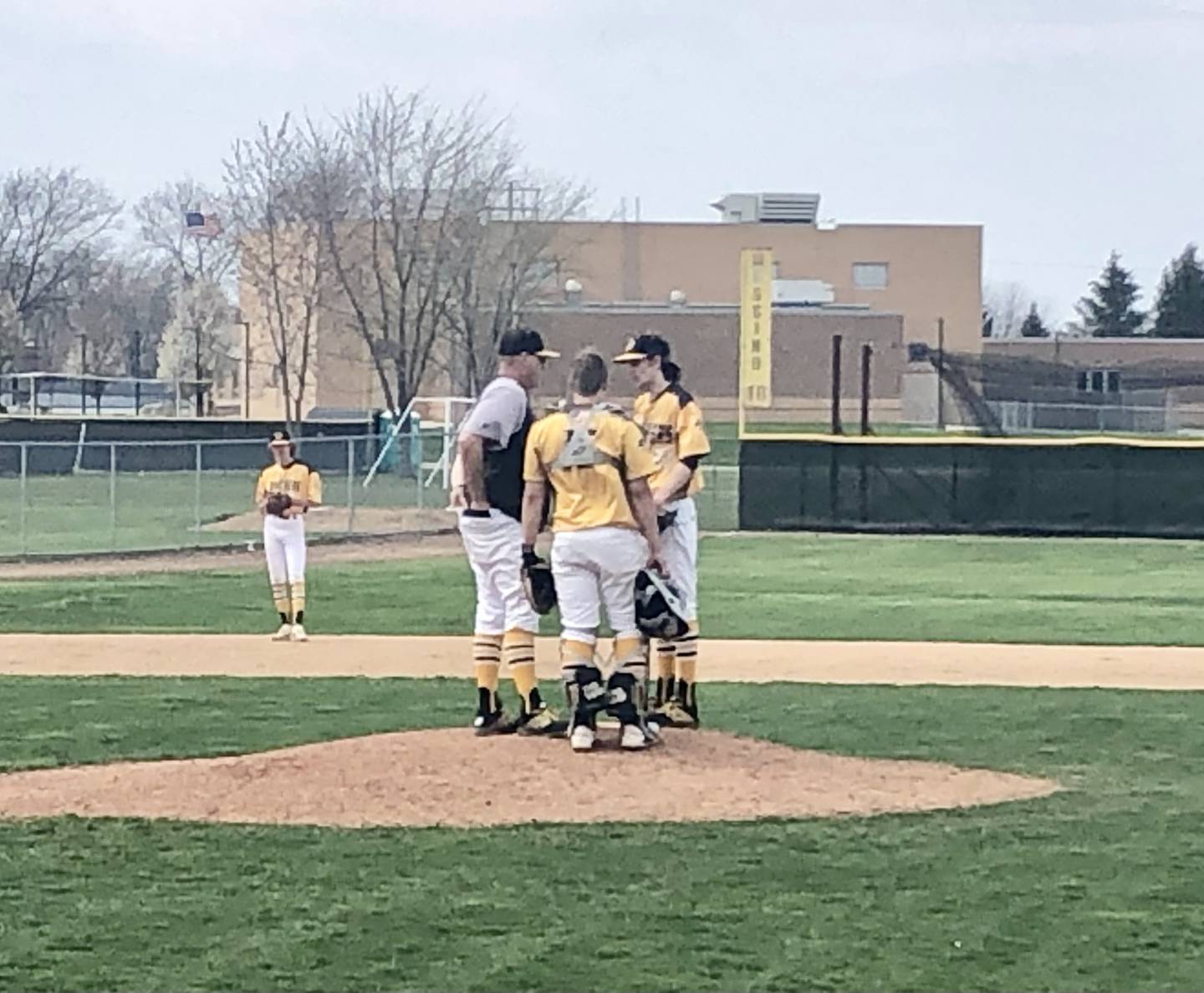 PC coach Chris Newsome talks shop during a mound visit in Saturday's game with Princeton. The Panthers won 13-11 on Andrew Pyszka's two-run walk-off home run.
