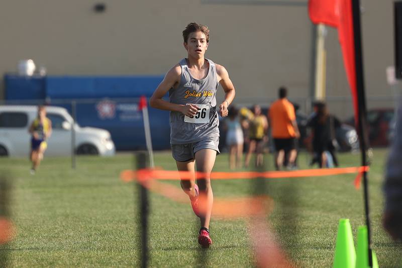Joliet West’s Julian Esquivel heads to the finish line for first place in the Joliet West Cross Country Dual Meet against Joliet Central on Monday, Aug. 28, 2023 in Joliet.